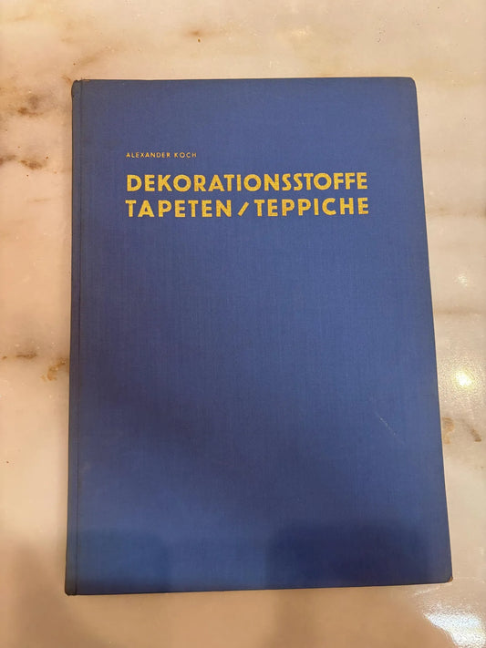 Vintage 1953 hardcover catalog titled "Dekorationsstoffe Tapeten Teppiche" published by Alexander Koch GmbH